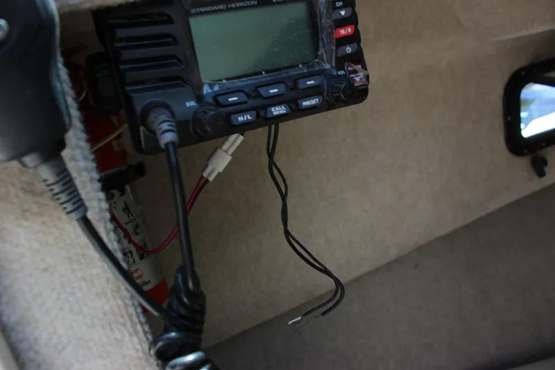 Slide: The Image of VHF radio equipment inside a 1996 Parker 2110 Walkaround boat. - 25