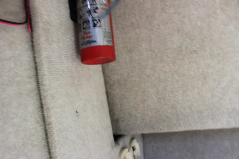 Slide: The Image of Fire extinguisher mounted on the interior of a 1996 Parker 2110 Walkaround boat. - 27