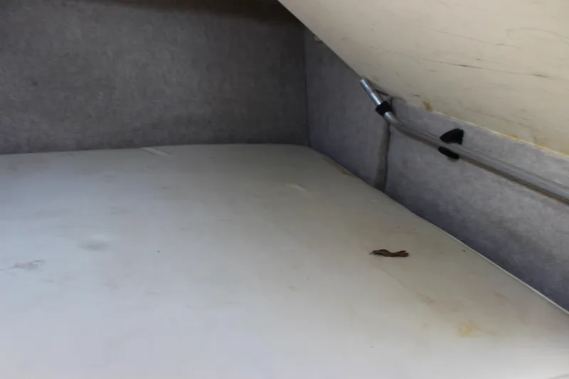 Slide: The Image of Interior cabin of 1996 Parker 2110 Walkaround boat with grey upholstery. - 29