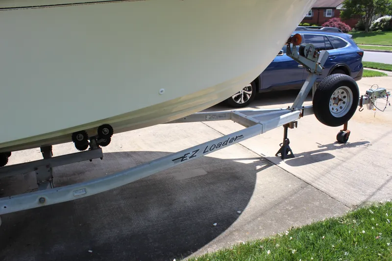 Slide: The Image of 1996 Parker 2110 Walkaround boat on EZ Loader trailer in driveway. - 33