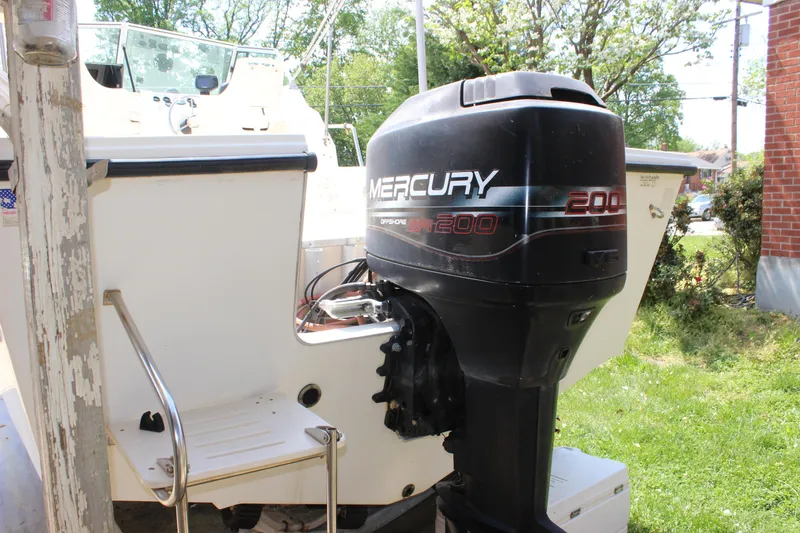Slide: The Image of 1996 Parker 2110 Walkaround boat with Mercury 200 outboard motor. - 37