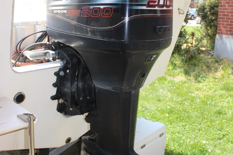 Slide: The Image of 1996 Parker 2110 Walkaround boat with a 200 HP outboard motor. - 38