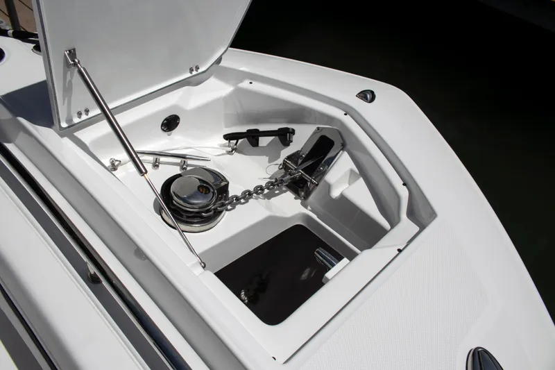 Slide: The Image of Anchor compartment of 2026 Blackfin 302 CC boat, showcasing chain and winch system. - 20