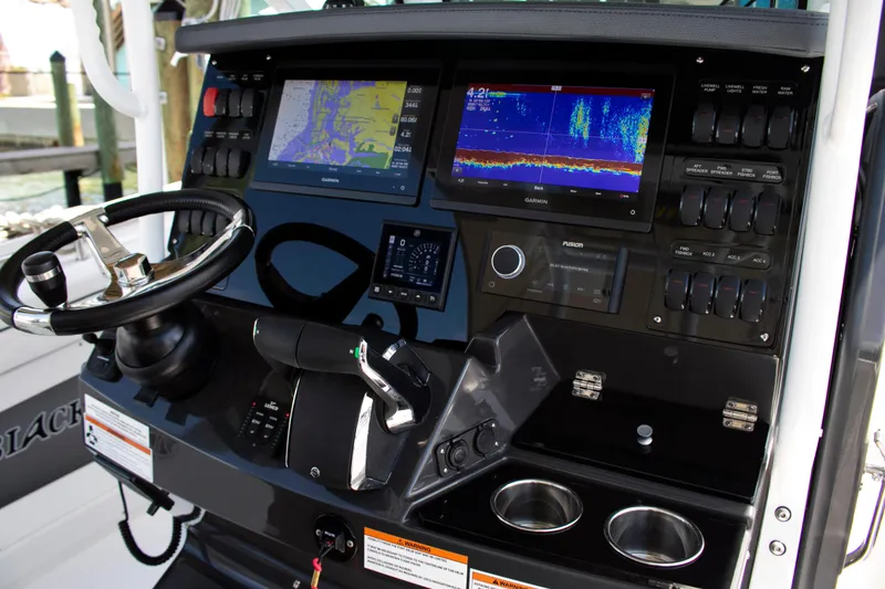 Slide: The Image of 2026 Blackfin 302 CC boat dashboard with advanced navigation and control systems. - 5