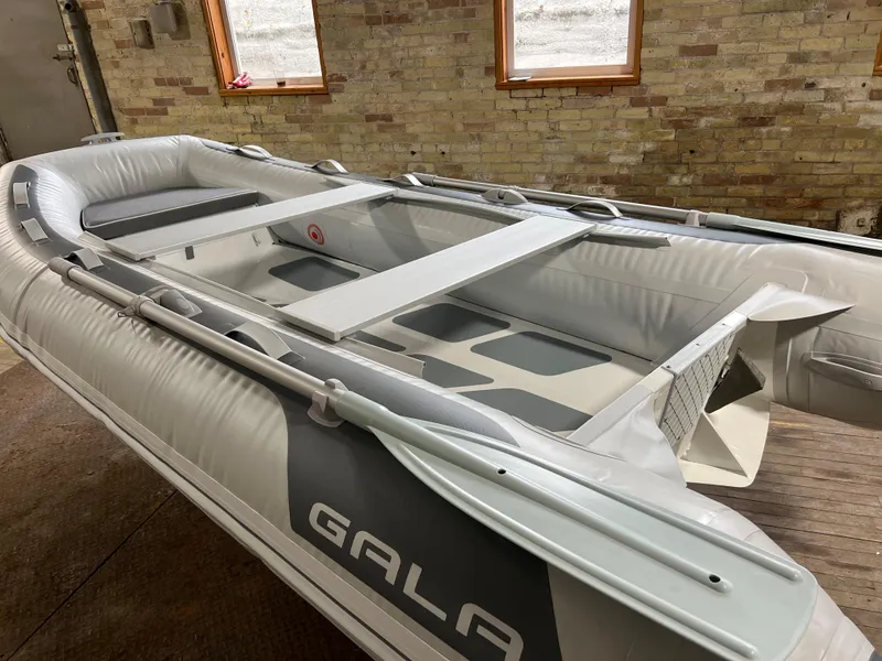 The Image of Gala A330D inflatable boat 2023 model in a brick-walled room. - 0
