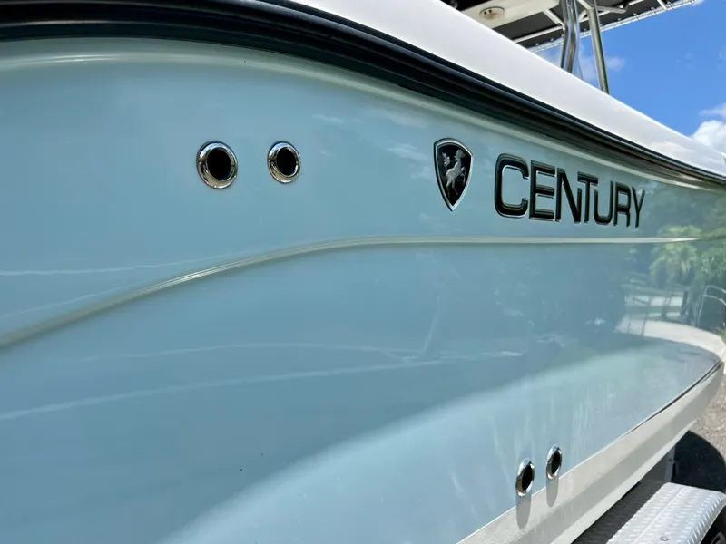 Slide: The Image of 2005 Century 2600 Center Console boat side view with logo. - 11