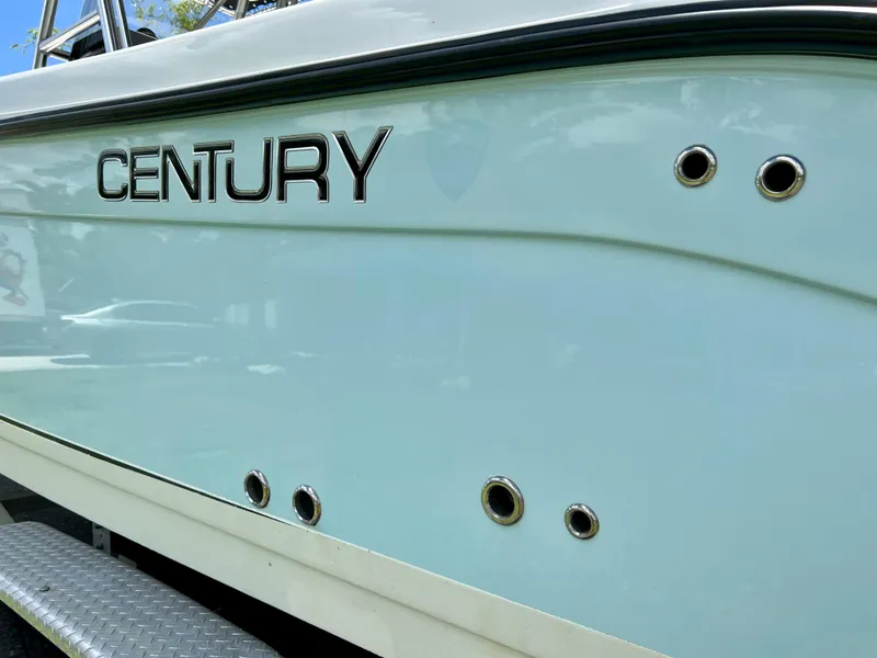 Slide: The Image of 2005 Century 2600 Center Console boat side view with logo. - 12