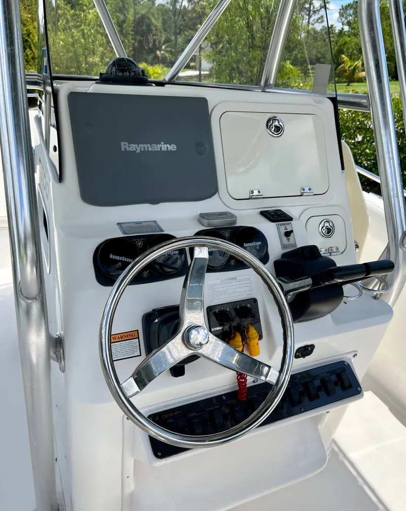 Slide: The Image of 2005 Century 2600 Center Console boat helm with Raymarine electronics. - 13