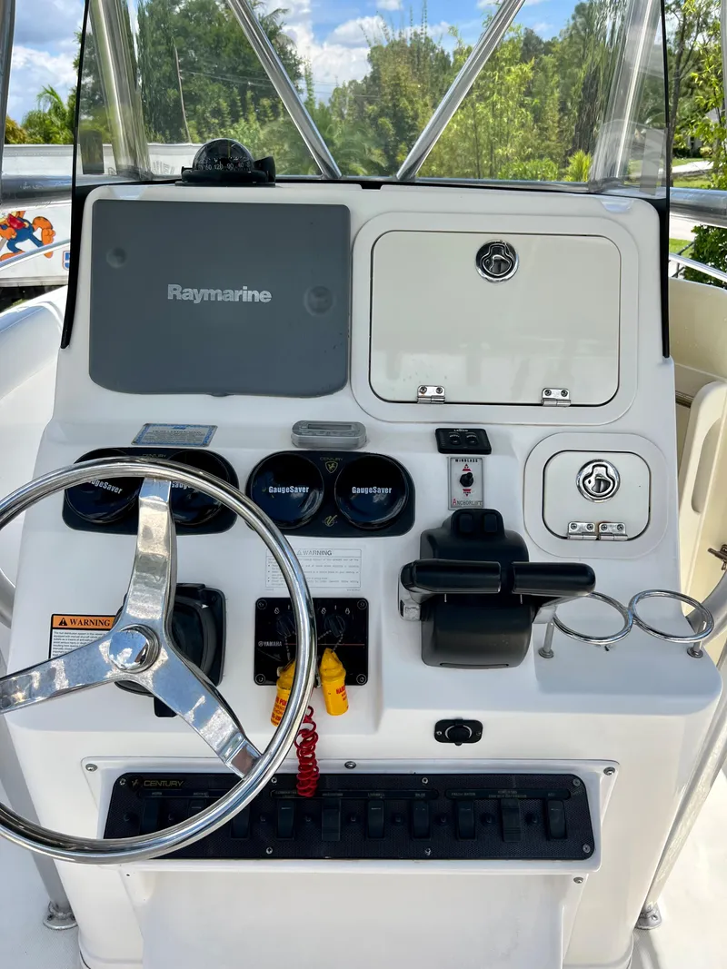 Slide: The Image of 2005 Century 2600 Center Console boat dashboard with Raymarine electronics. - 14