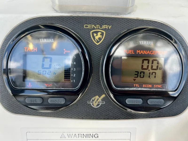 Slide: The Image of Century 2600 Center Console 2005 dashboard with Yamaha tachometer and fuel management displays. - 20