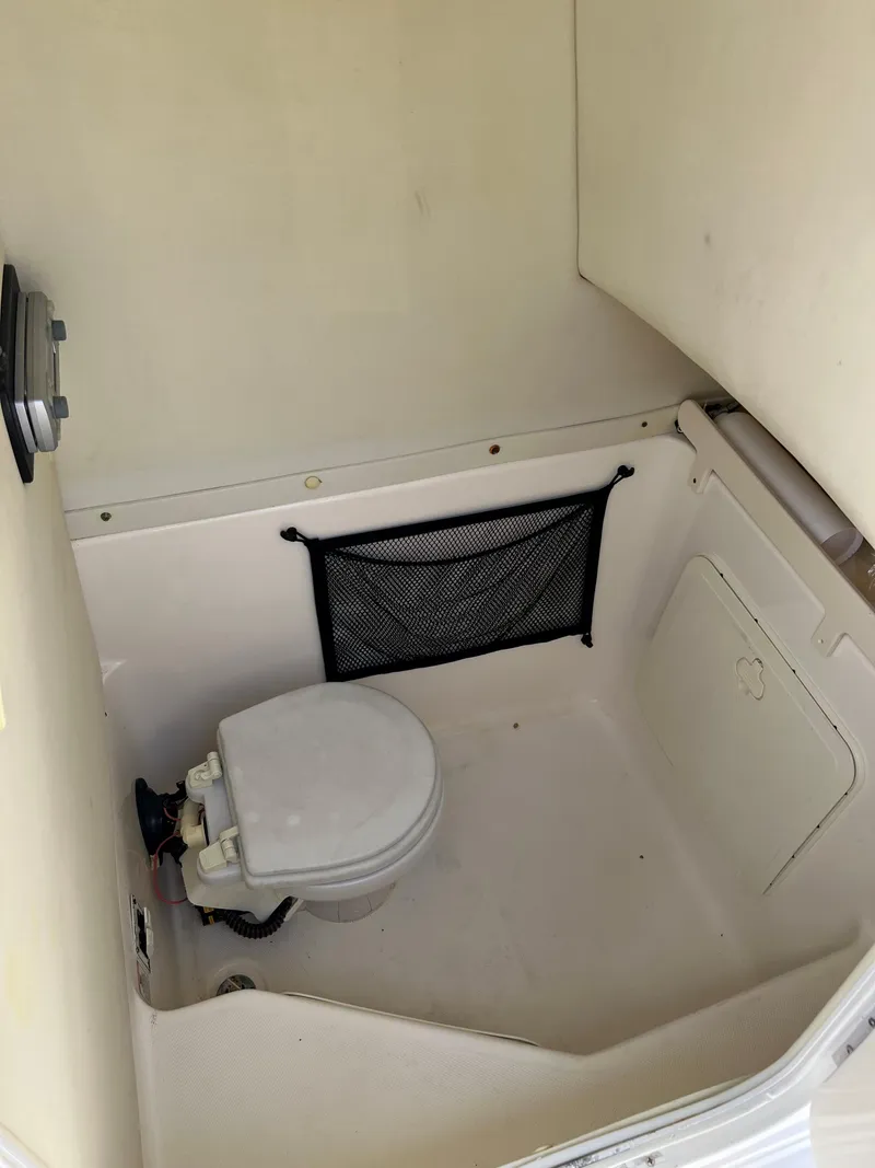 Slide: The Image of 2005 Century 2600 Center Console boat interior with marine toilet. - 22