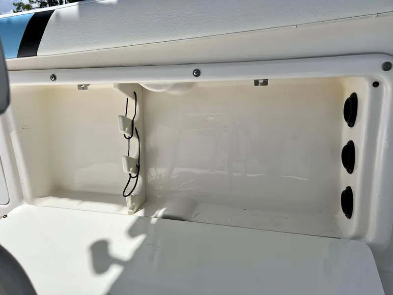 Slide: The Image of 2005 Century 2600 Center Console boat storage compartment. - 24