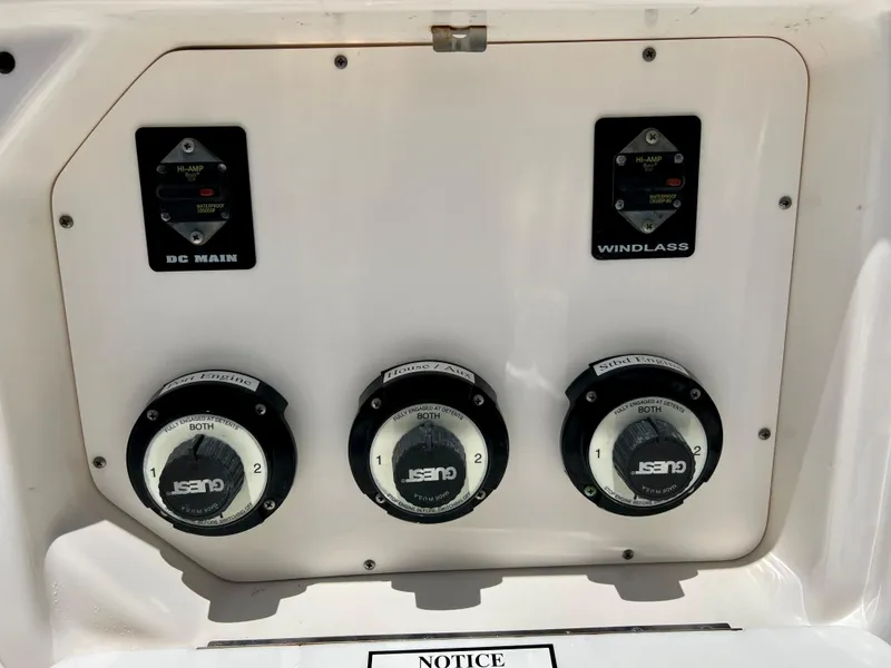 Slide: The Image of 2005 Century 2600 Center Console boat control panel with switches and gauges. - 25