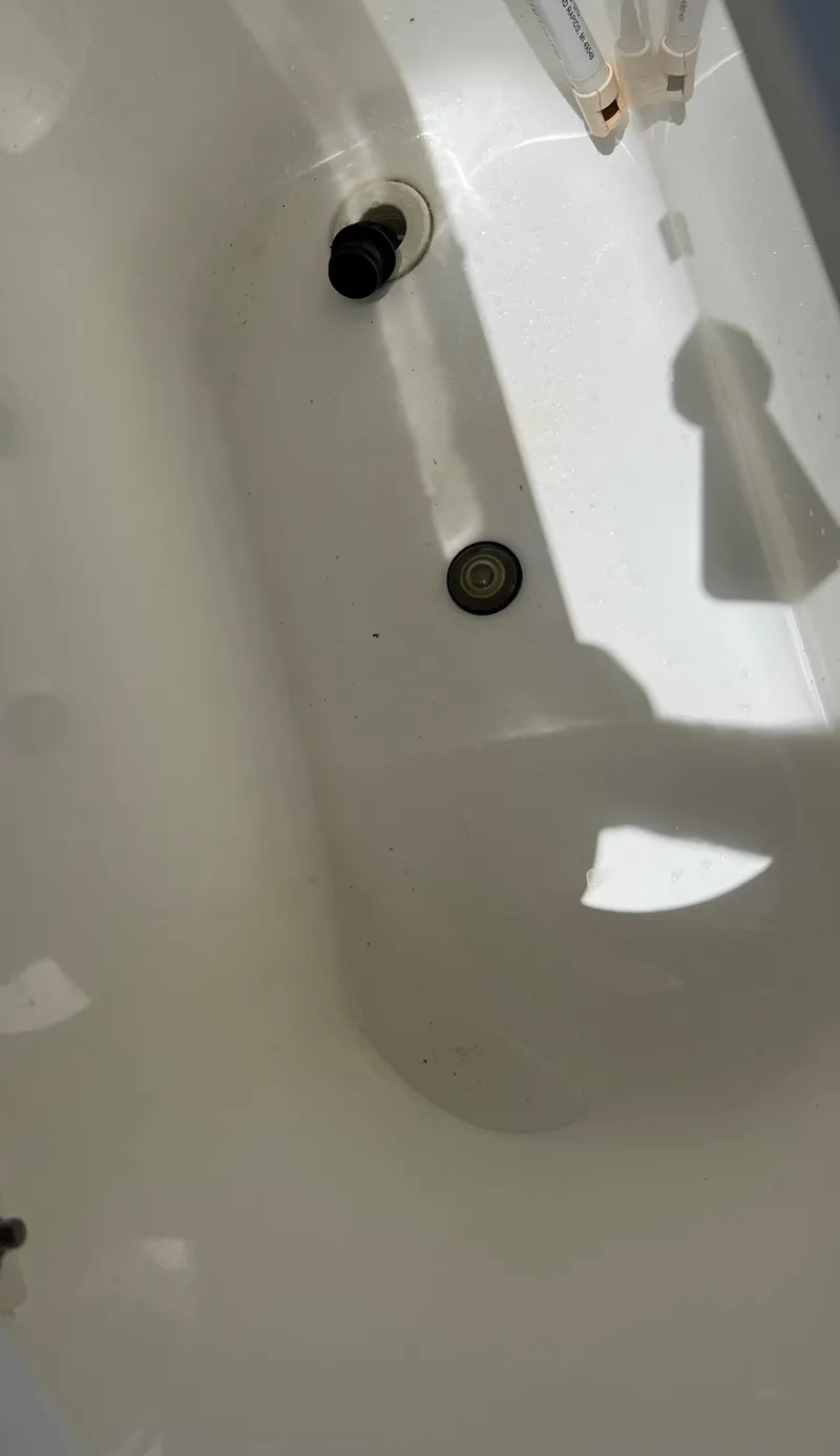 Slide: The Image of 2005 Century 2600 Center Console boat interior detail showing clean white surface. - 31