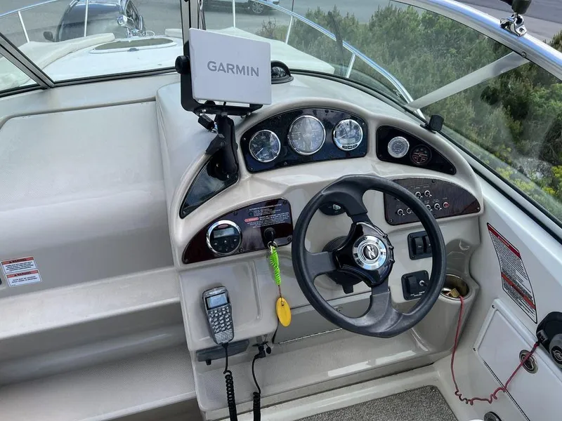 Slide: The Image of 2007 Sea Ray 260 Sundancer helm with Garmin GPS and marine radio. - 5