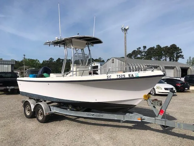 The Image of 2005 May-Craft 2000 CC boat on trailer in outdoor storage area. - 1