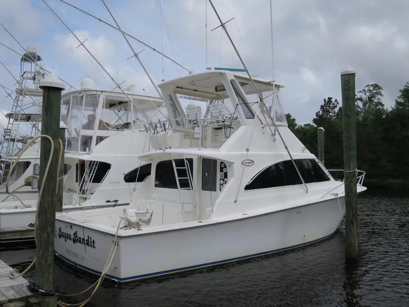 The Image of 1999 Ocean Yachts docked at marina with other boats. - 0