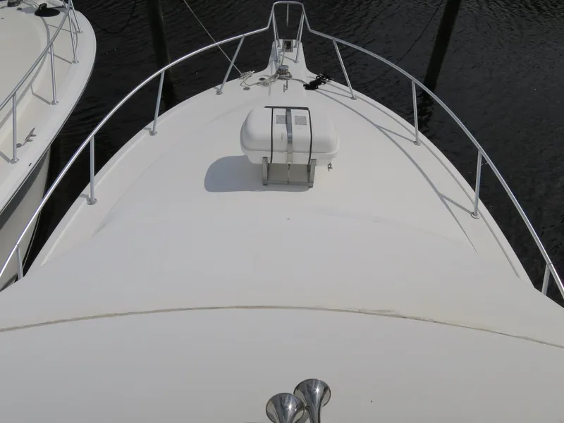 Slide: The Image of 1999 Ocean Yachts bow view with railing and life raft. - 2