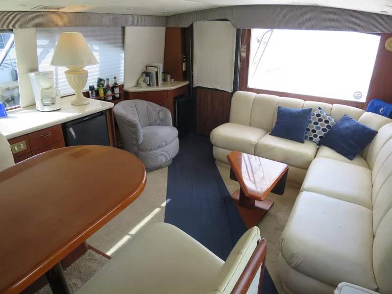Slide: The Image of Luxurious 1999 Ocean Yachts interior with plush seating, mini bar, and elegant decor. - 5