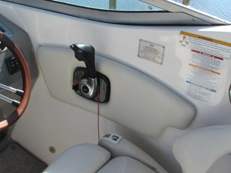 Slide: The Image of Chaparral Signature 2012 boat cockpit with throttle control and steering wheel. - 13