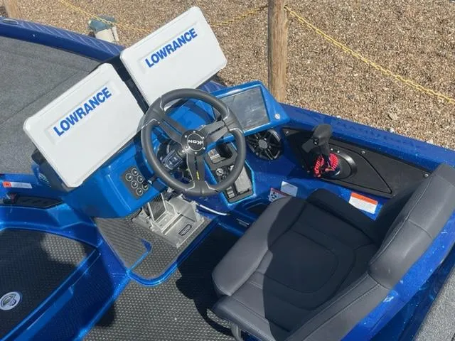 Slide: The Image of 2024 iKon LX21 boat cockpit with Lowrance electronics and steering wheel. - 8