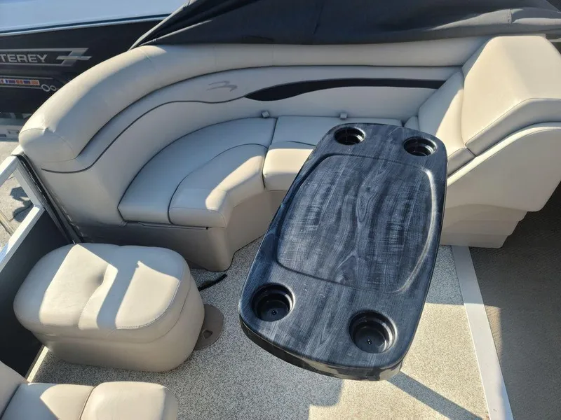 Slide: The Image of 2016 Bennington 20 SS boat interior with seating and table. - 11