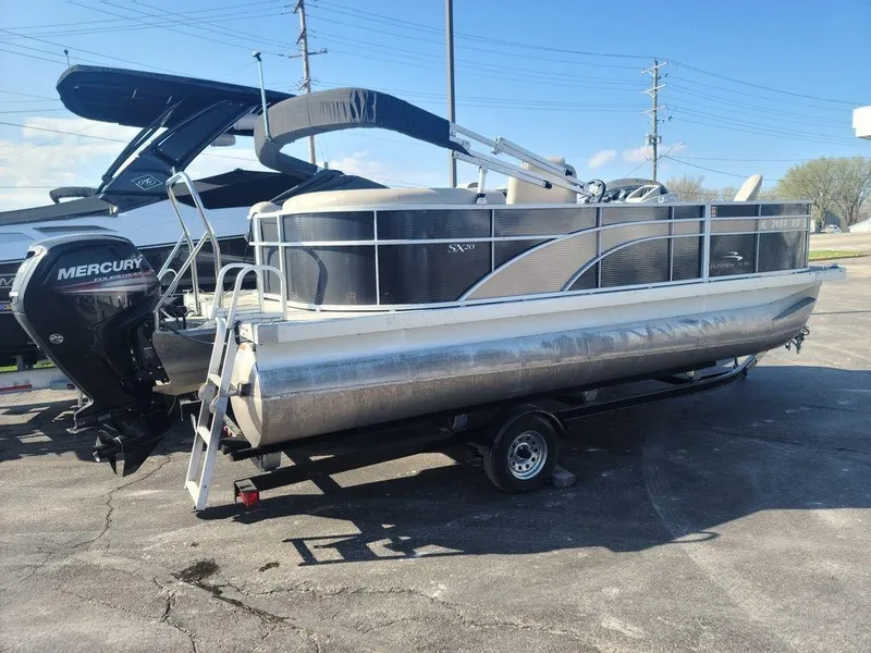 Slide: The Image of 2016 Bennington 20 SS pontoon boat with Mercury outboard motor on trailer. - 3