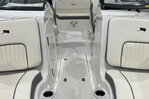 Slide: The Image of 2023 Stingray 211DC boat interior with white and gray seating. - 3