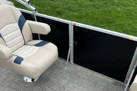 Slide: The Image of 2023 SunCatcher Select 20RC boat interior with beige and blue captain's chair. - 5