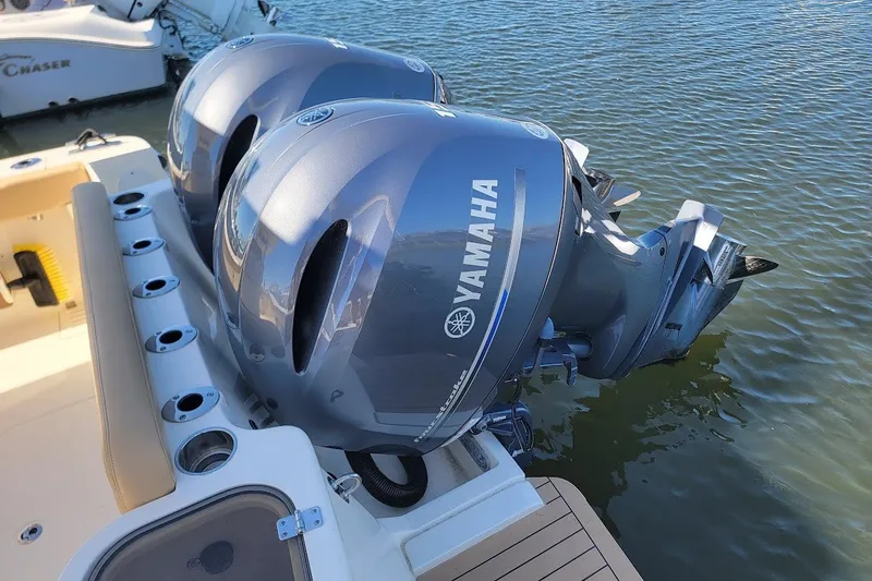 Slide: The Image of Twin Yamaha outboard engines on a 2020 Scout 255 LXF boat in water. - 10