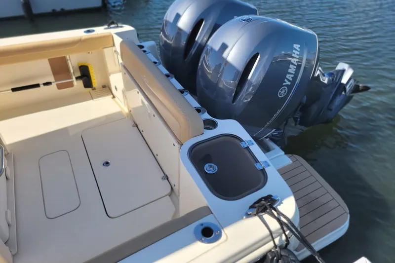 Slide: The Image of 2020 Scout 255 LXF boat with Yamaha outboard engines, docked on water. - 24