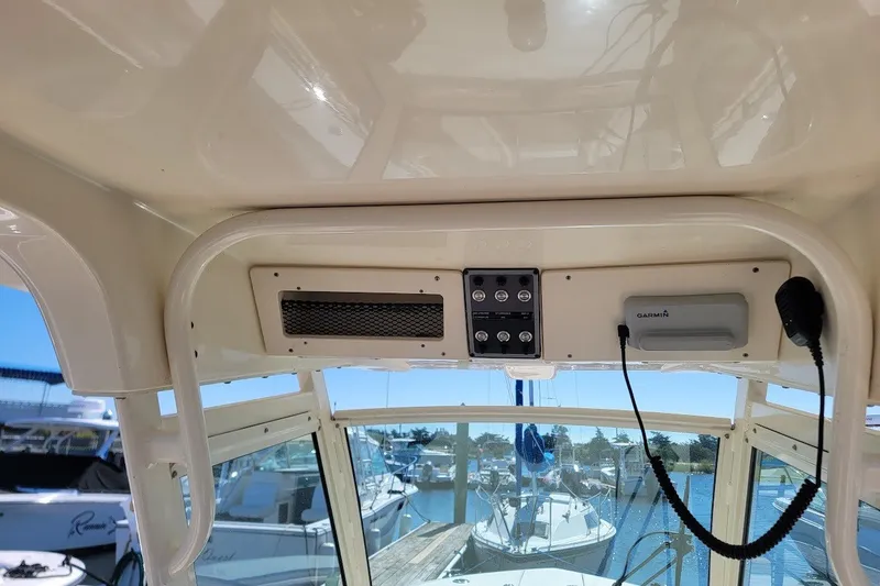Slide: The Image of Interior view of a 2020 Scout 255 LXF boat with control panel and Garmin device. - 21