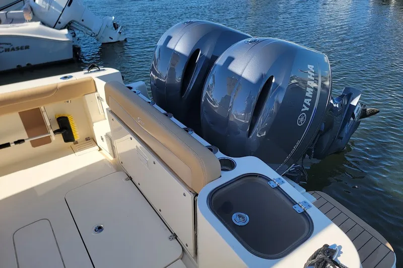 Slide: The Image of 2020 Scout 255 LXF boat with Yamaha outboard engines on water. - 9