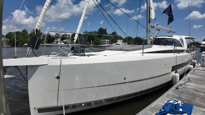 The Image of 2024 Jeanneau 55 yacht docked, showcasing sleek design and modern features under a clear blue sky. - 0