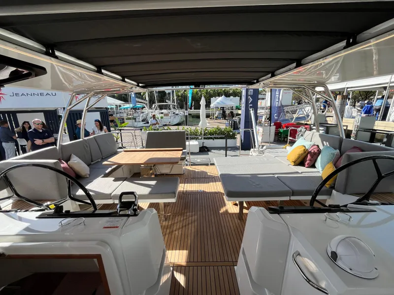 Slide: The Image of 2024 Jeanneau 55 yacht interior with spacious seating and modern design. - 13