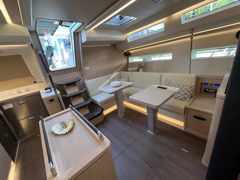 Slide: The Image of Modern interior of 2024 Jeanneau 55 yacht with spacious seating and dining area. - 17