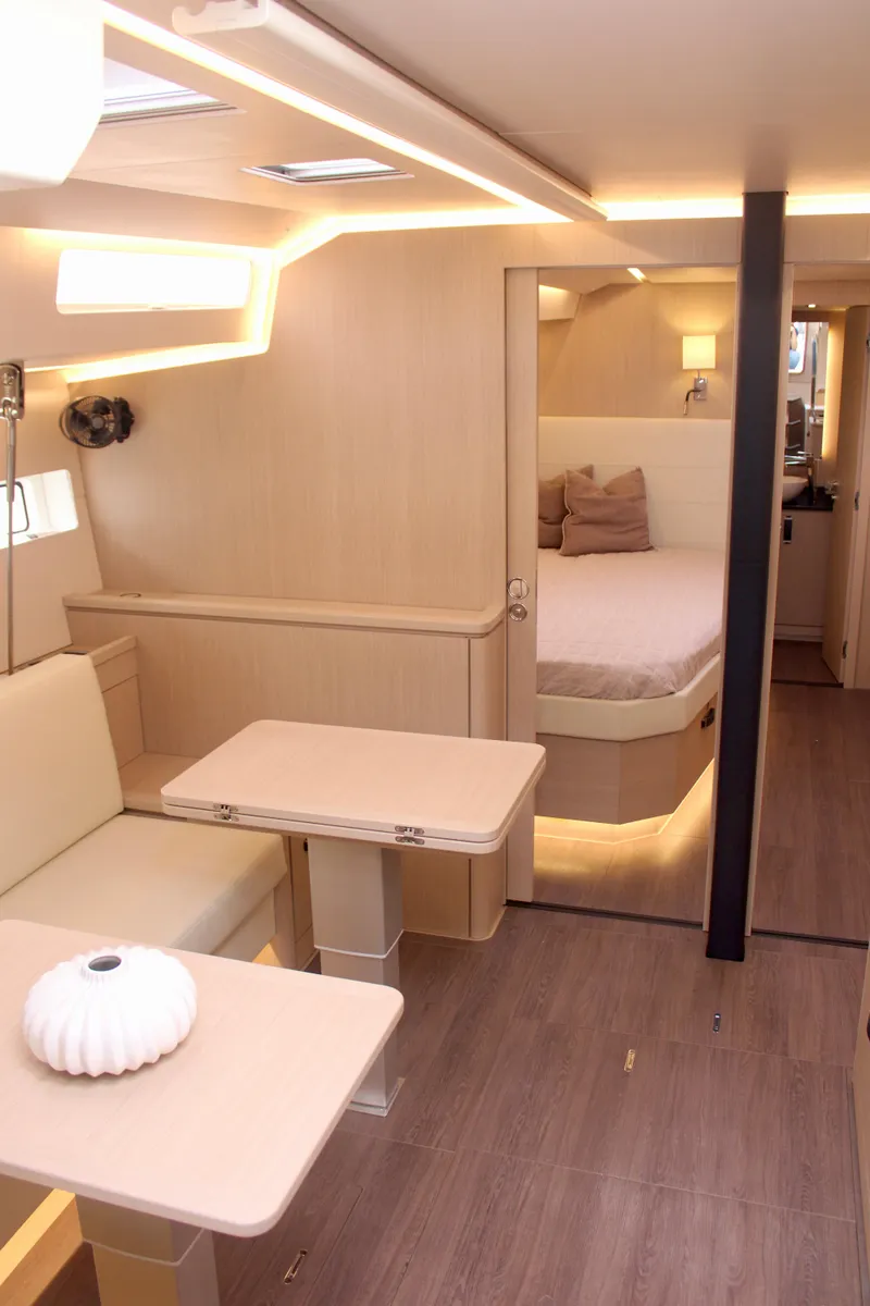Slide: The Image of Modern interior of 2024 Jeanneau 55 yacht with cozy seating and bedroom. - 20