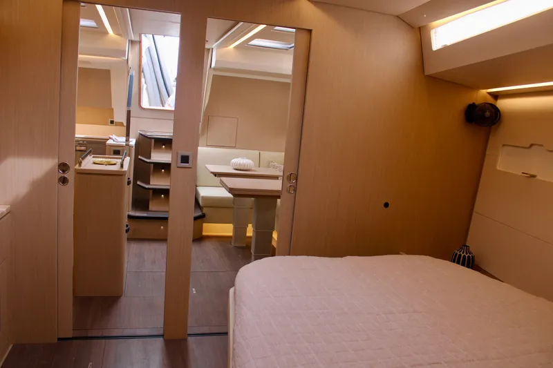 Slide: The Image of Interior of 2024 Jeanneau 55 yacht, featuring modern design and cozy living space. - 32