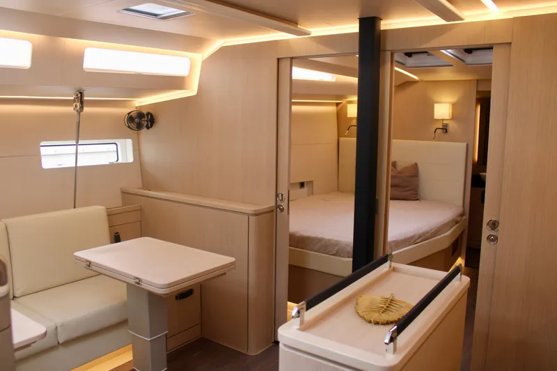 Slide: The Image of Modern interior of 2024 Jeanneau 55 yacht with cozy bedroom and dining area. - 34