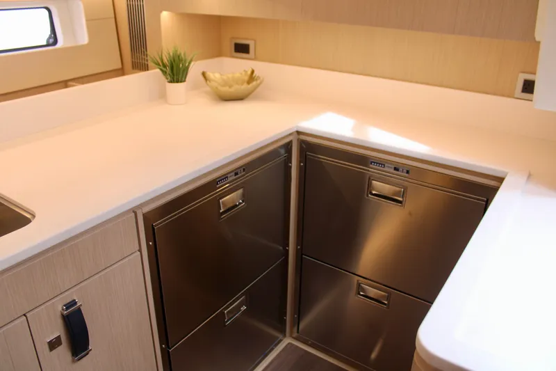 Slide: The Image of Modern kitchen area in 2024 Jeanneau 55 yacht with stainless steel appliances. - 38