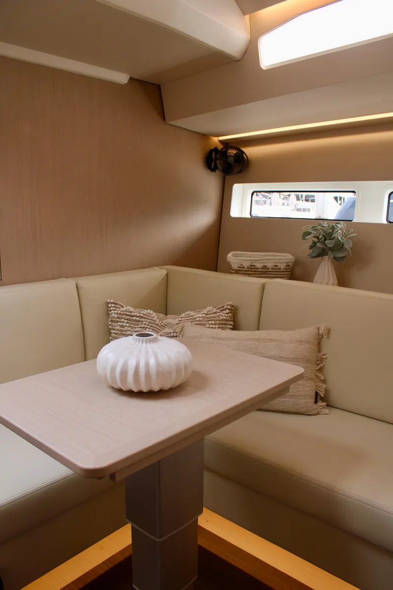 Slide: The Image of Modern interior of 2024 Jeanneau 55 yacht with cozy seating and elegant decor. - 39