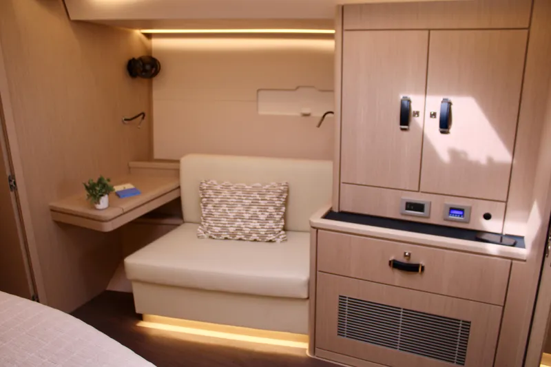 Slide: The Image of Luxurious interior of 2024 Jeanneau 55 yacht with modern seating and cabinetry. - 43