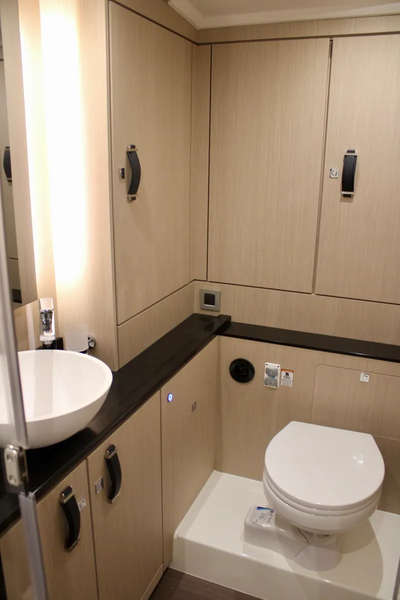 Slide: The Image of Modern bathroom in 2024 Jeanneau 55 yacht with sleek fixtures and ample storage. - 47