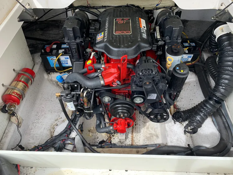Slide: The Image of 2010 Four Winns H220 boat engine compartment with batteries and fire extinguisher. - 10