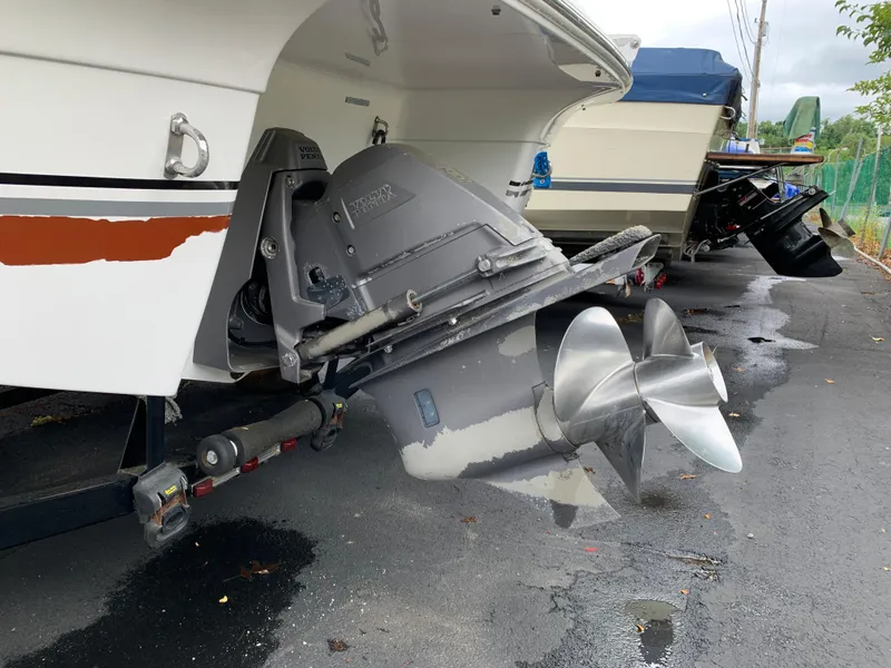 Slide: The Image of 2010 Four Winns H220 boat stern drive and propeller on trailer. - 9