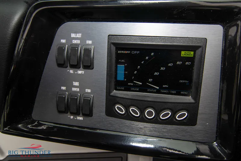 Slide: The Image of 2023 MasterCraft NXT22 control panel with ballast and tabs switches. - 27