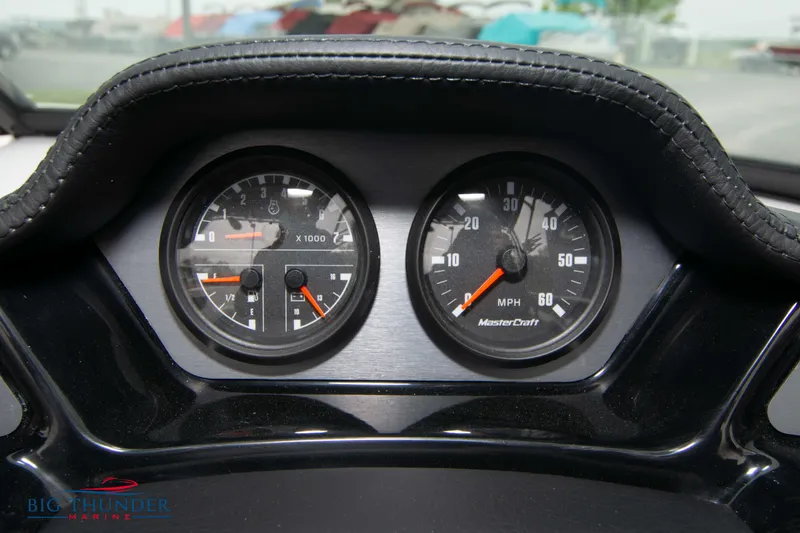Slide: The Image of 2023 MasterCraft NXT22 dashboard gauges showing RPM and speed. - 28