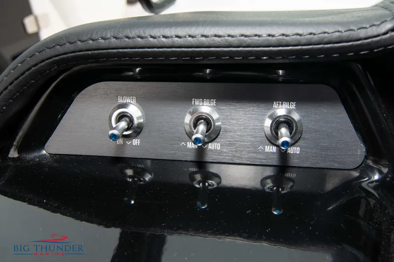 Slide: The Image of 2023 MasterCraft NXT22 control panel with blower and bilge switches. - 29