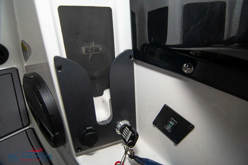 Slide: The Image of 2023 MasterCraft NXT22 boat dashboard with ignition key and control panel. - 32