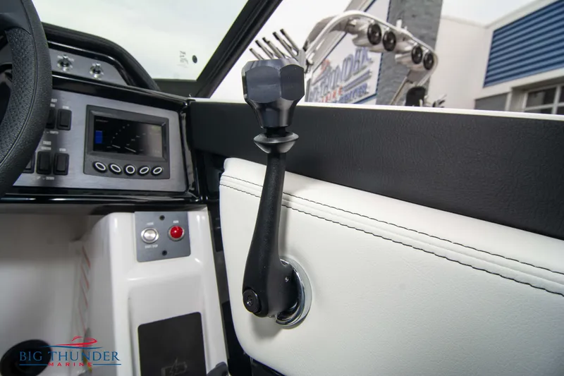 Slide: The Image of 2023 MasterCraft NXT22 boat interior, dashboard and control lever. - 34